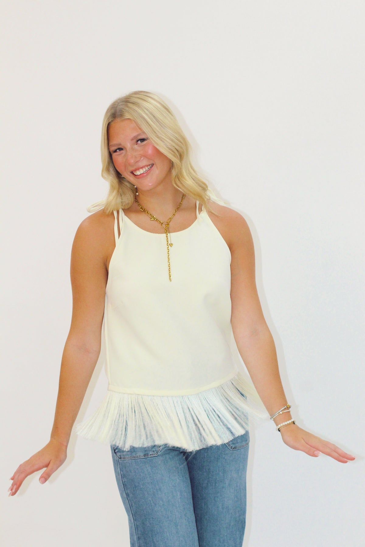 Her Sleeveless Fringe Top